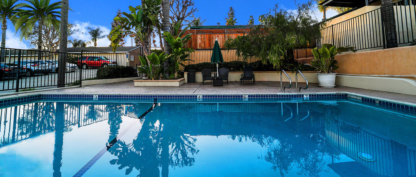 This image shows the apartments swimming pool with water moving, symbolizing relaxation & serenity.